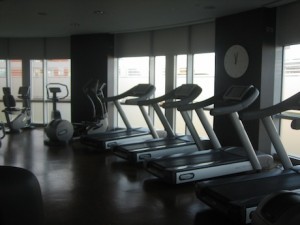 Hotel gyms that focus on not just male but female guests include spinning equipment and treadmills, like this gym at the Radisson Edwardian New Providence Wharf.